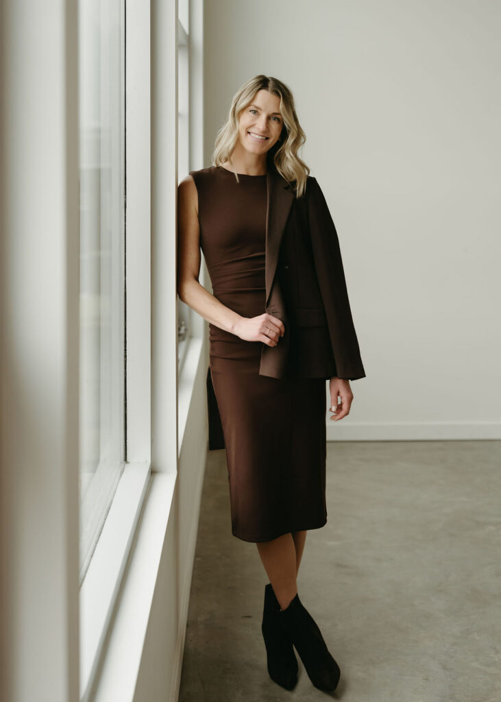 Calgary branding photography with a headshot of a woman in a brown suit.
