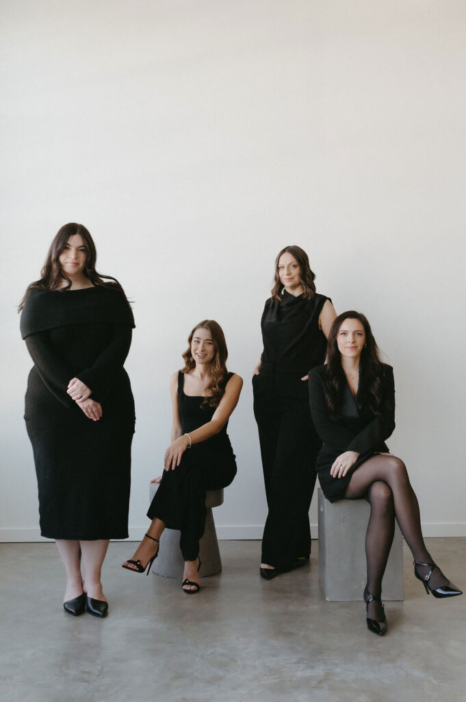  A group of woman having their portrait taken in a studio in Calgary.