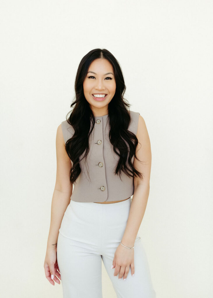 A woman standing in a studio getting her Calgary headshot done.
