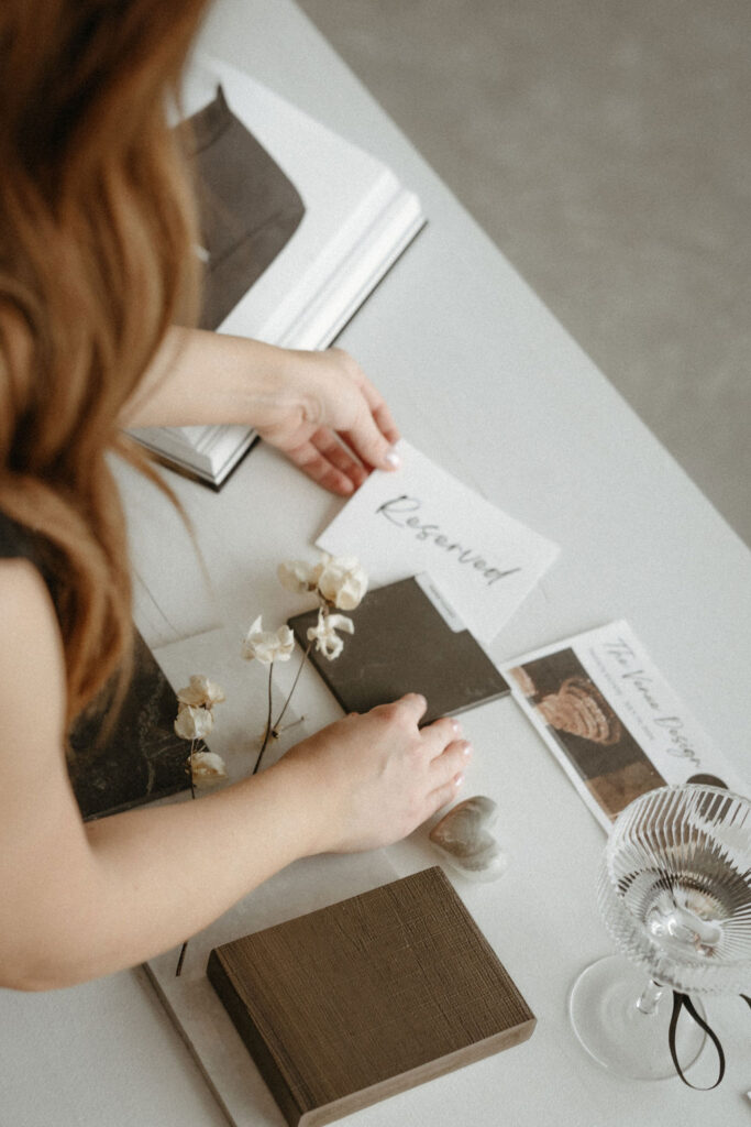 A woman having brand photography while showing a reserved sign in Calgary.