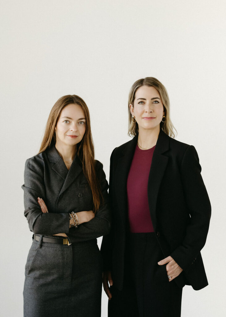Two women having their headshots taken in a studio in Calgary, Alberta.