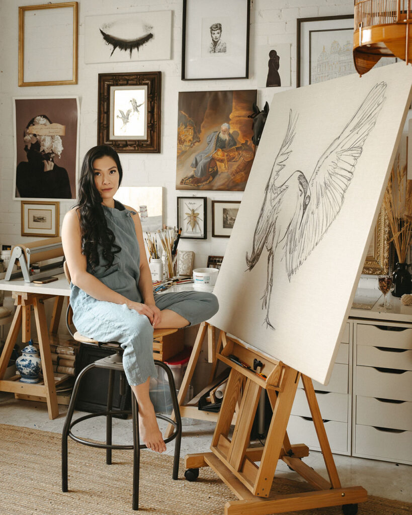 An artist in a studio in Calgary having her portrait taken. 