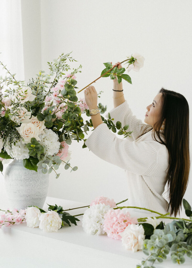 A florist having her portrait taken in a studio in Calgary.