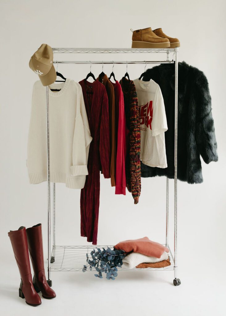A Calgary stock photographer taking an image of clothing on a rack in a studio.